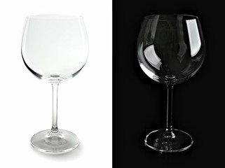 Two empty wine glasses, isolated on black and white backgrounds