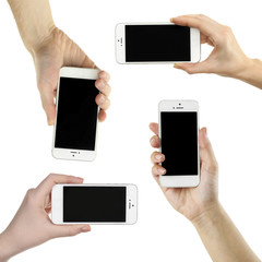 Hands holding smart phones, isolated on white