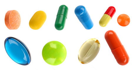 Different pills shaped as frame isolated on white