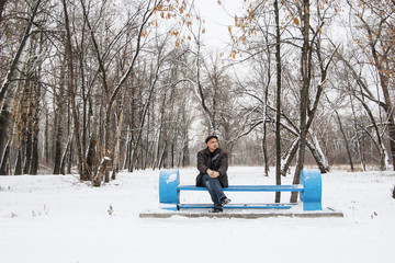 Lonely man in the winter park