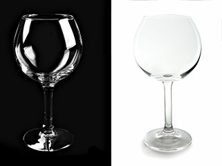 Two empty wine glasses, isolated on black and white backgrounds