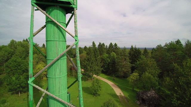 The green observation tower in Enumagi hill. When on top of the tower seen is the green wide view of the forest of Enumagi in Estonia