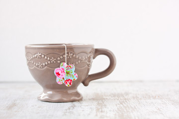 cup with flower shape teabag