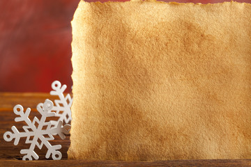 Christmas background - snowflakes and paper sheet