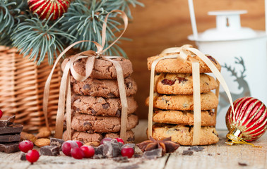 Fototapeta na wymiar Chocolate cookies and biscuits with cranberries. Christmas gifts