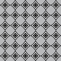 Pattern with white and black rhomboid shapes on grey background   