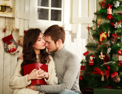 Couple in love on a background of Christmas decorations