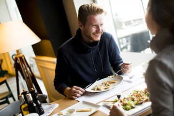 Young couple having lunch in the restaurant