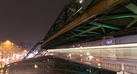 Fototapeta na wymiar schwebebahn train wuppertal germany speed blur in the evening