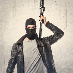 Robber holding a rifle