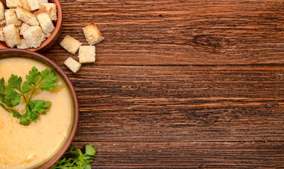 Obraz na płótnie Canvas Pea soup with croutons. Background.