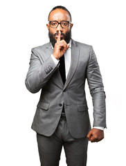 Fototapeta premium business black man doing a silence gesture