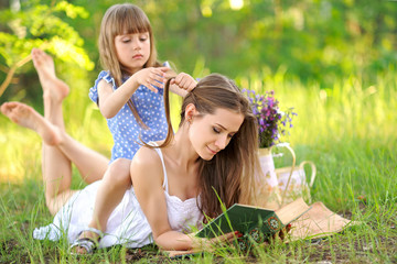 portrait of a happy family in the summer on the nature