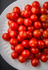 Fresh cherry tomatoes on a white plate