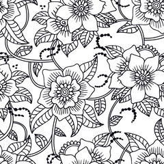 Floral seamless pattern with hand drawn doodle flowers.