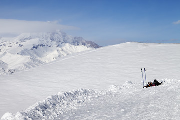 Fototapeta na wymiar Skiing and snowboarding equipment on slope at sunny day