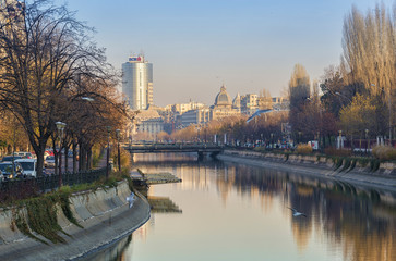 Cityscape from Bucharest with Dambovita River in sunset light