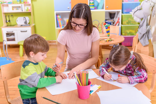 kindergarten creative class - teacher and kids
