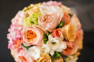 bridal bouquet with wedding rings