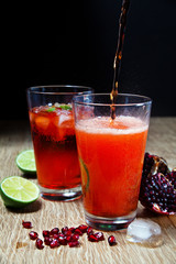 Lemonade with fresh berries and pomegranate.