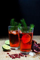 Lemonade with fresh berries and pomegranate.