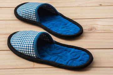 Indoor handmade soft shoes on wooden floor