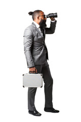 full body business black man holding a suitcase and binoculars