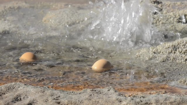 Two eggs boiling in geothermal waters of the El Tatio geyser in San Pedro de Atacama, Chile. 