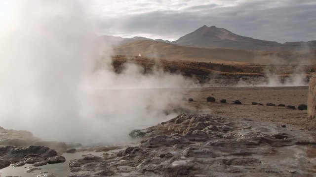 El Tatio geysers steam at sunrise at the famous El Tatio geyser valley at 4320 meters above sea level,  Chile.
