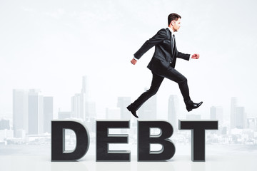 Fototapeta premium Businessman overcome debt problems concept at city background