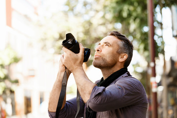 Male photographer taking picture