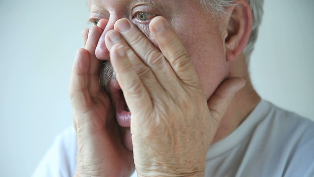 Older man has nasal congestion and other signs of a cold or flu.