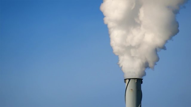 smoke on blue sky, industrial chimney pollution