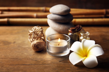 Decorated relax treatments with frangipani flower on wooden background