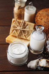 Spa coconut products on dark wooden background