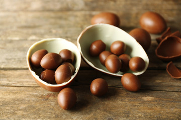 Chocolate Easter eggs on wooden background