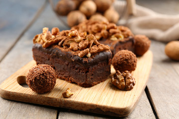 Pieces of chocolate cake with walnut on the table, close-up