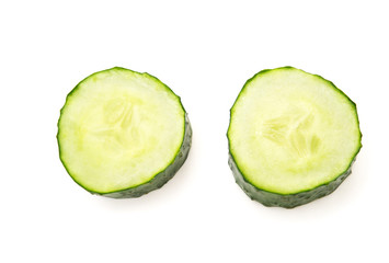 fresh cucumber slices on a white background