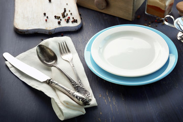 Kitchenware served for breakfast on dark wooden background