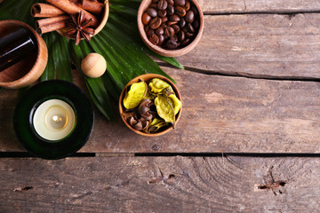 Beautiful spa setting on palm leaf on wooden table