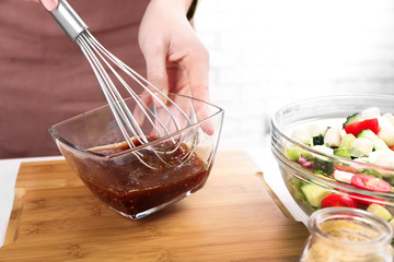 Process of preparing sauce for salad, at kitchen