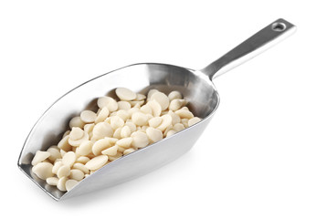 Chocolate morsels in scoop isolated on white