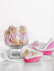 Tasty marshmallows with chocolate in bowl on table, close up