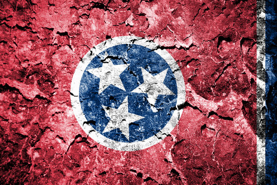 Tennessee State Flag painted on cracked wall 