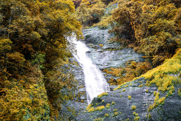 Beautiful autumn waterfall in deep forest in Chiang Mai, Thailand.