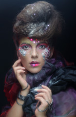 Fashion portrait of a beautiful model with creative make up