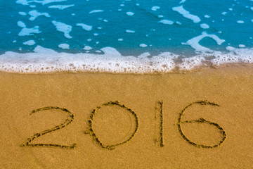 Happy New Year 2016 on the sea beach