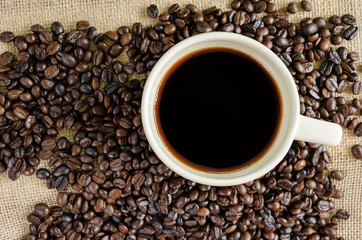 Hot americano and coffee beans