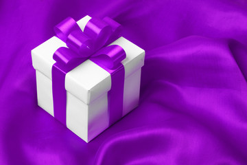 gift on purple satin background