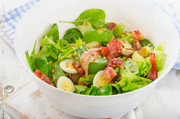 Salad with bacon, egg and potatoes.